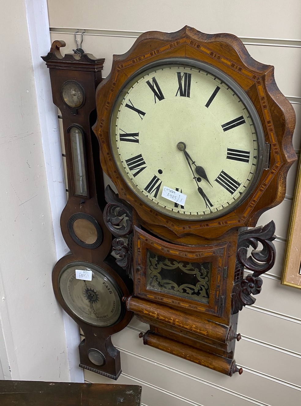 A Victorian inlaid drop dial wall clock and a 19th century wheel barometer